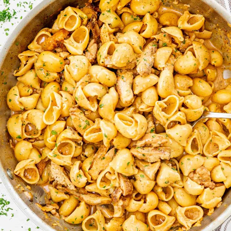 creamy jerk chicken pasta in a skillet.