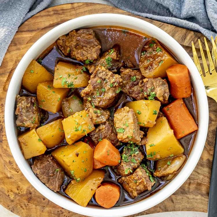 a serving with Irish lamb stew in a white bowl.