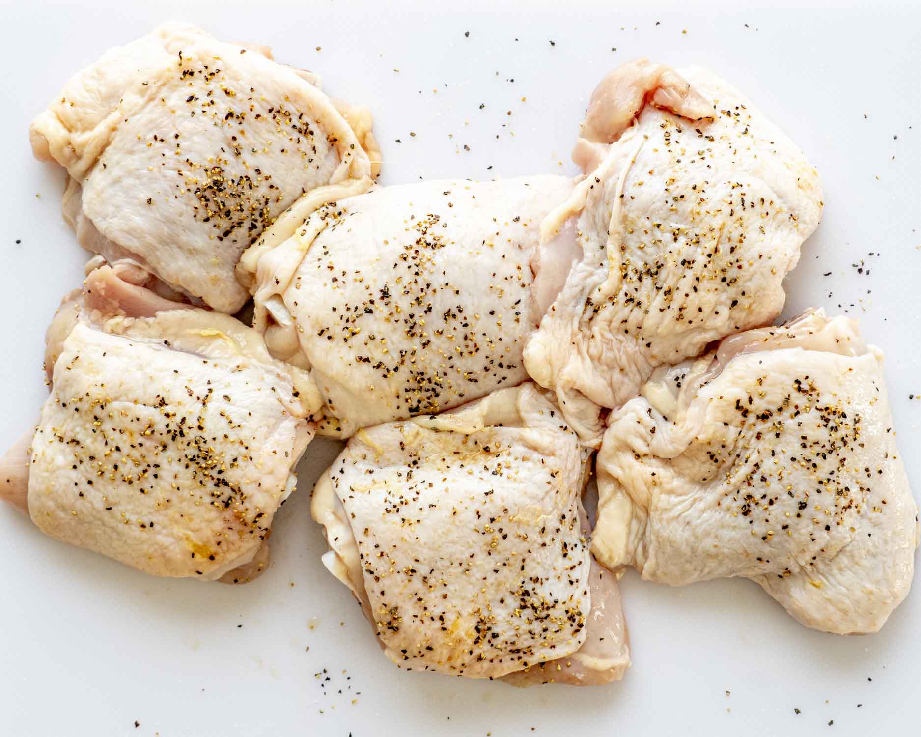 process shots showing how to make oven baked chicken thighs.