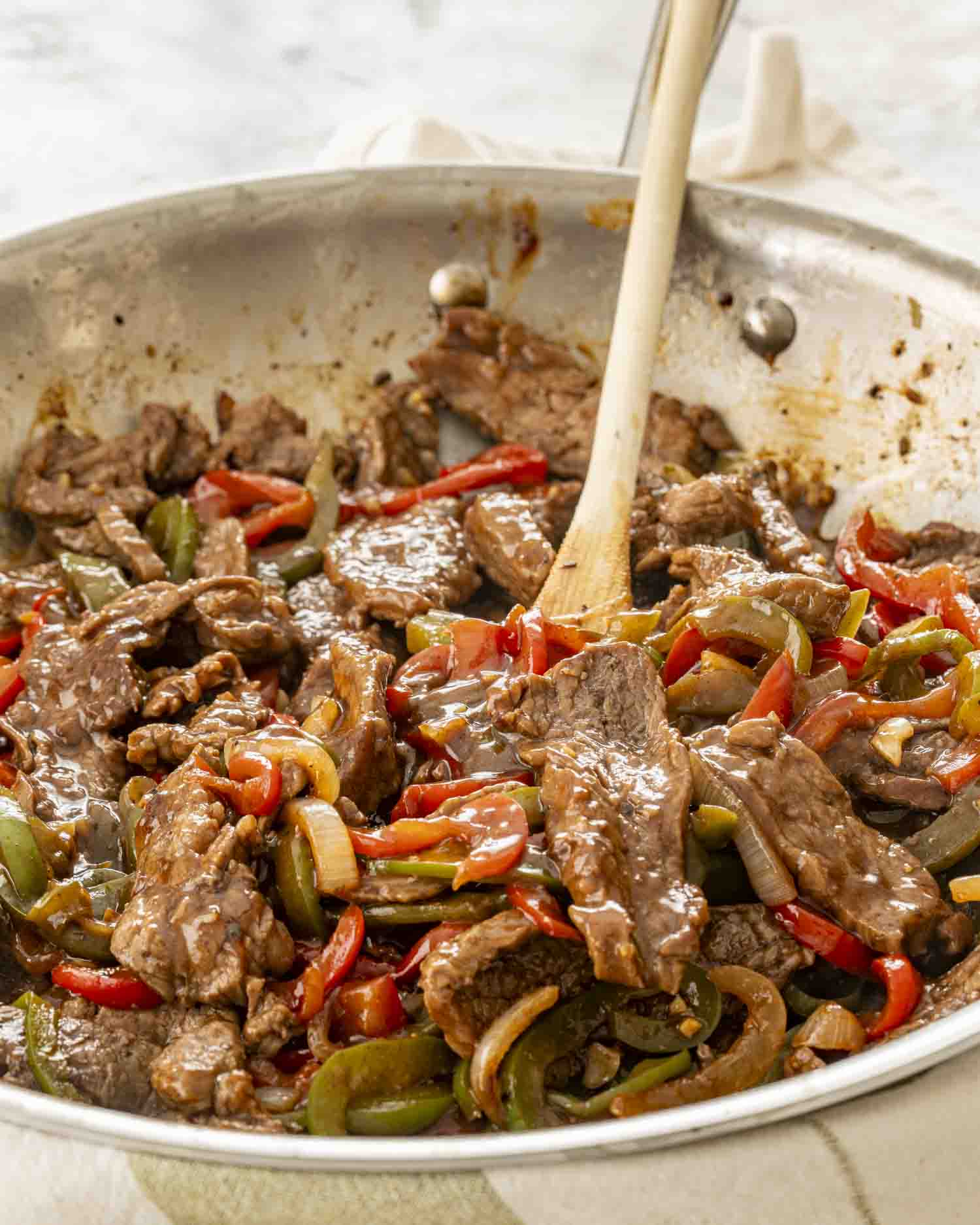 freshly made pepper steak in a skillet.