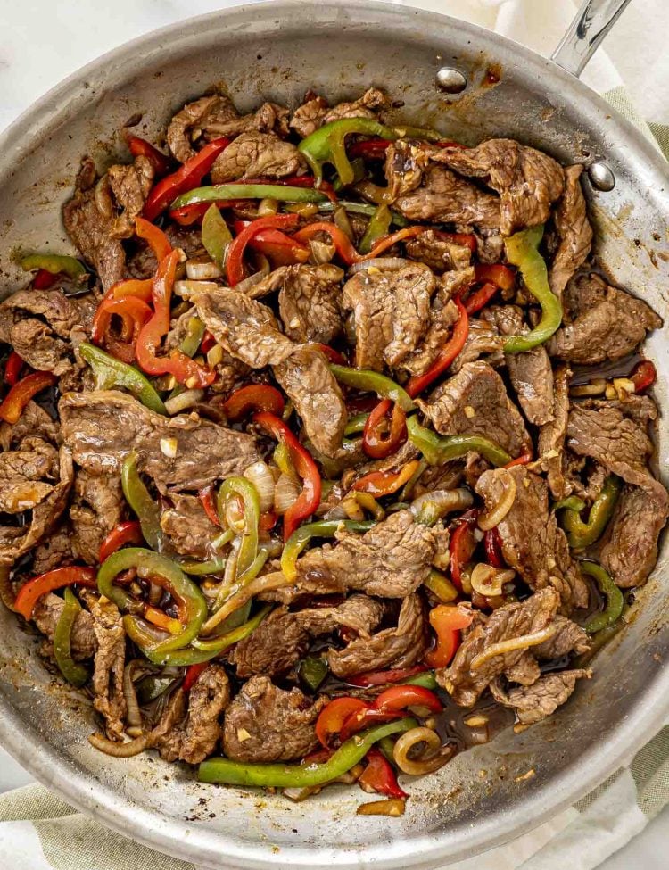 freshly made pepper steak in a skillet.