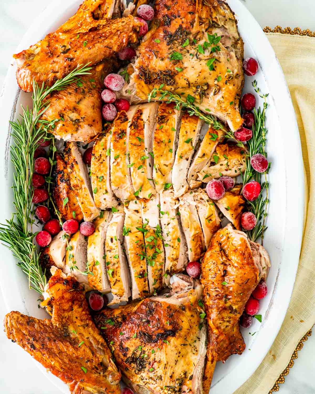 overhead shot of carved turkey on a platter.