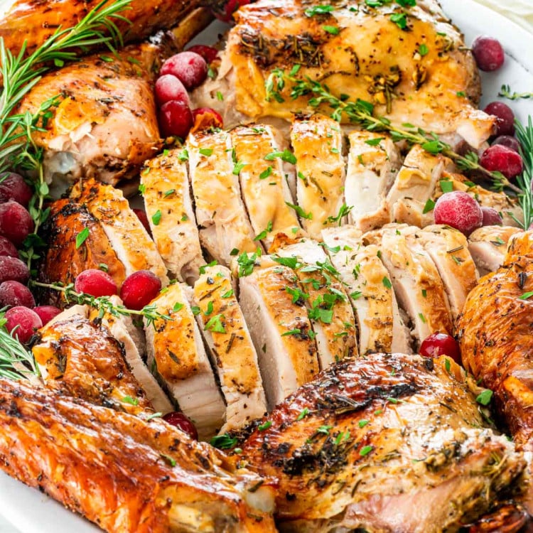 closeup of carved turkey on a serving platter.