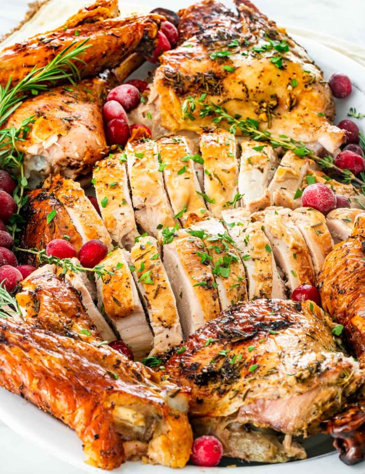 closeup of carved turkey on a serving platter.